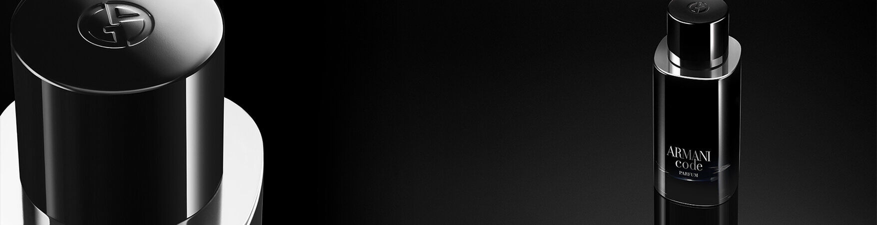 A sleek black bottle of Armani Code fragrance, partially illuminated against a dark background, showcasing its modern and elegant design.