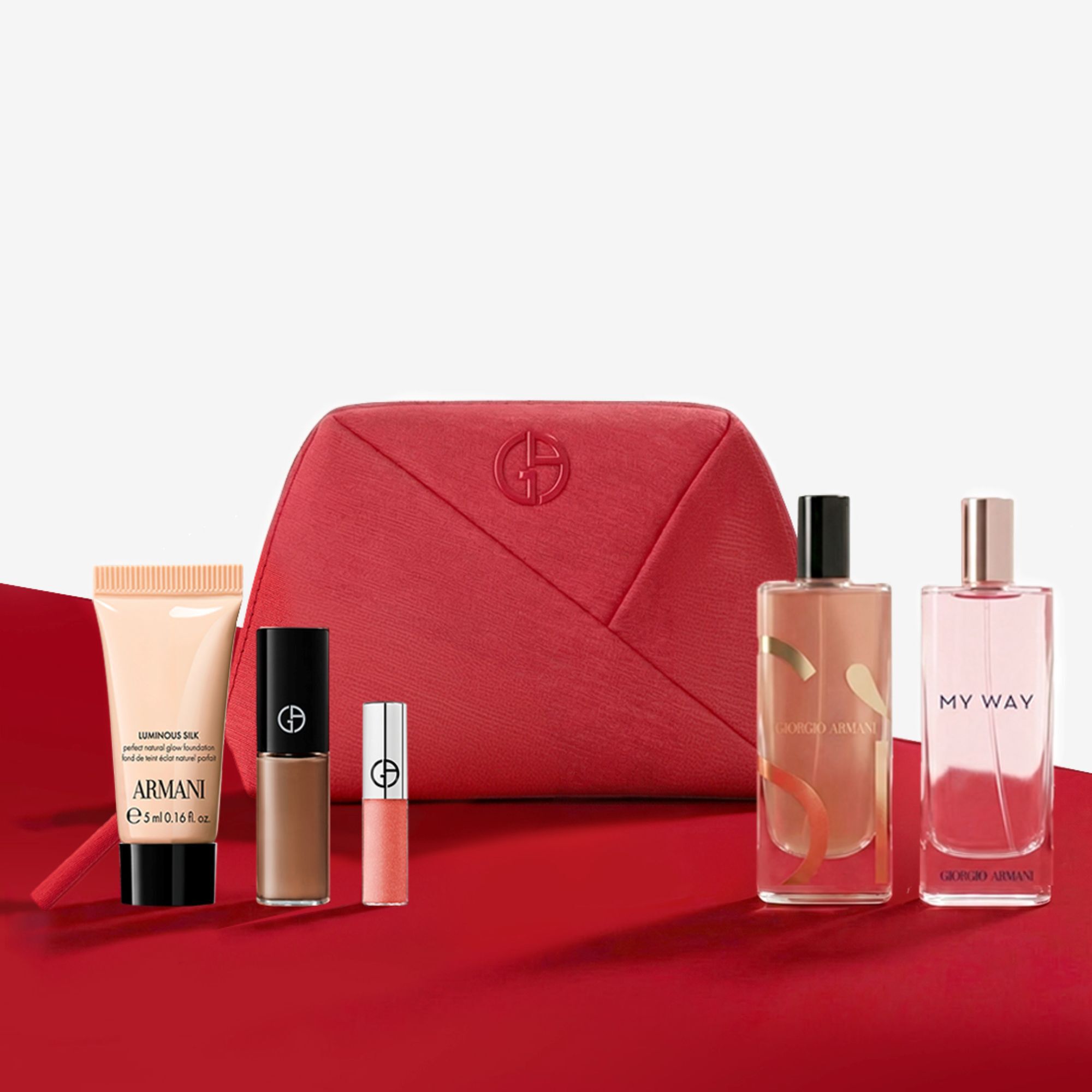 Set bellezza Giorgio Armani con pochette rossa, profumi e trucchi.