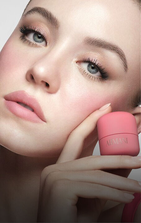 SYDNEY  holding the pink Armani Beauty Dolci Blush with a natural soft-matte finish.