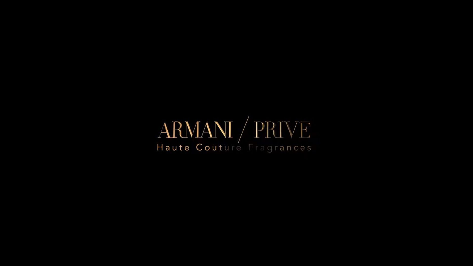 Text on a black background: "ARMANI/PRIVE Haute Couture Fragrances" in elegant gold lettering.
