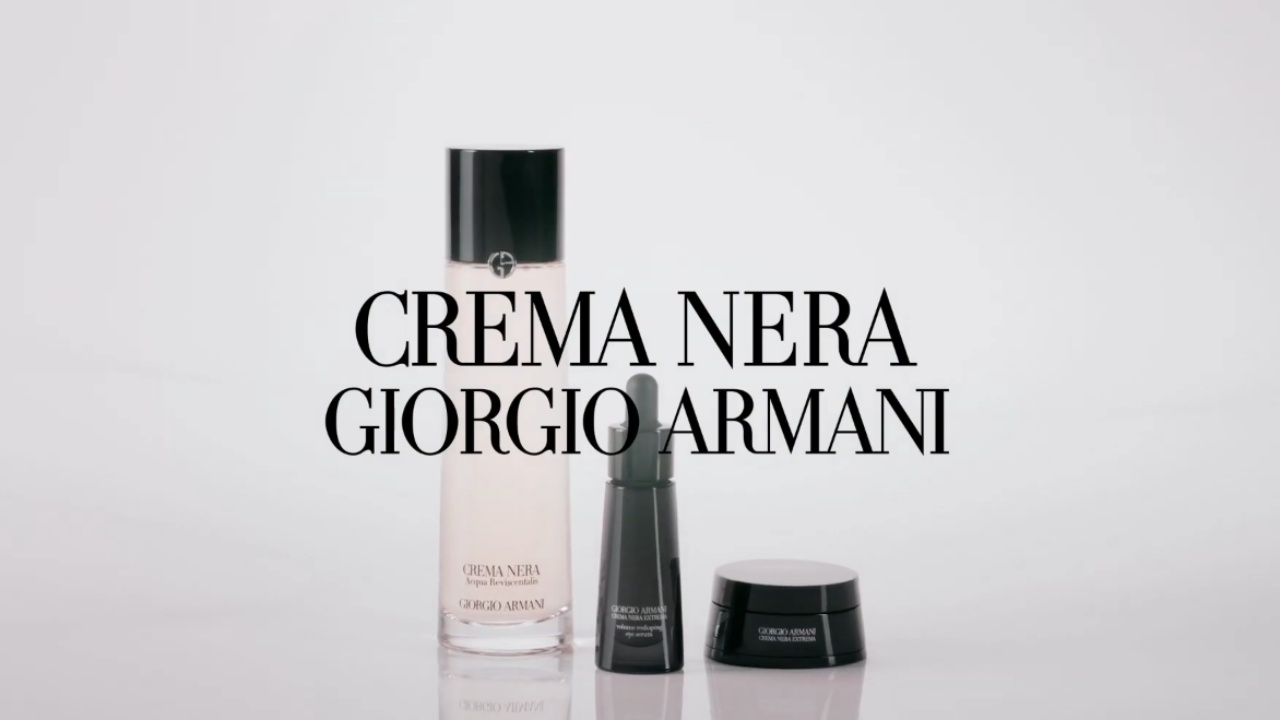 A beauty product display featuring Crema Nera skincare from Giorgio Armani, including a bottle and two jars.