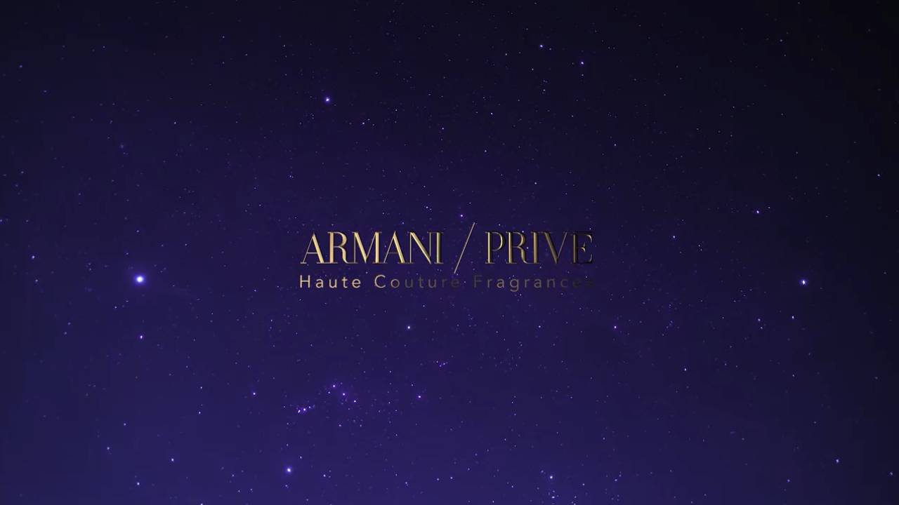 Logo di Armani Privé su uno sfondo stellato, rappresentante una fragranza di alta moda.